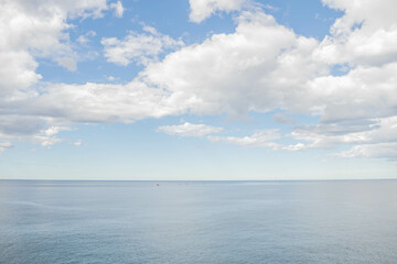 Background of a calm sea with clouds