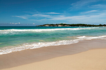 El Macau beach and in the distance on the horizon cliffs, the Atlantic Ocean.