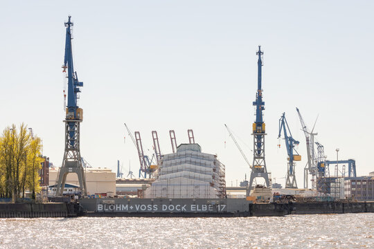 Hamburg, Germany - April 17th 2022: The world’s largest yacht Dilbar in the Blohm + Voss dry dock Elbe 17 in the Hamburg harbor, seized by German authorities