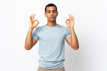 African American man over isolated white background in zen pose