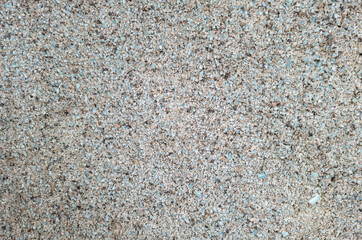 Background of small blue pebbles in a concrete solution.