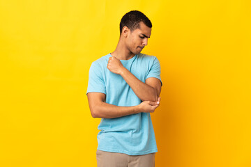 African American man over isolated background with pain in elbow