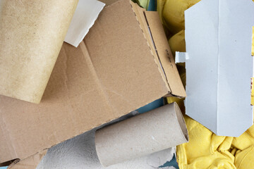 Paper recycling garbage. Sorting waste paper packaging at home. Wastepaper for background, texture.