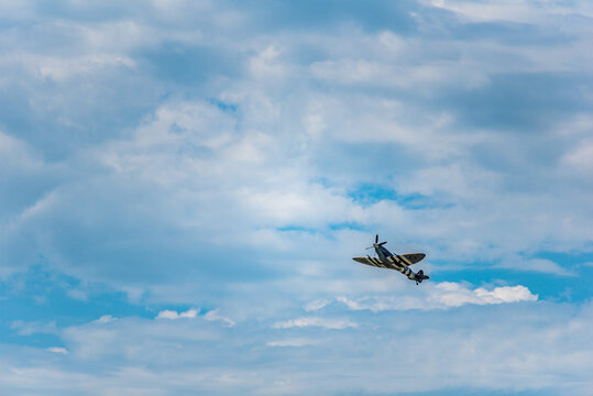 Moose Jaw, Saskatchewan, Canada- July 7, 2019: Supermarine Spitfire Mk IX climbing at the Saskatchewan Airshow