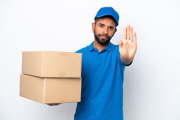 Delivery Brazilian man isolated on white background making stop gesture