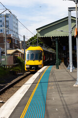 Fototapeta na wymiar Commuter train approaching Homebush train station Sydney NSW Australia