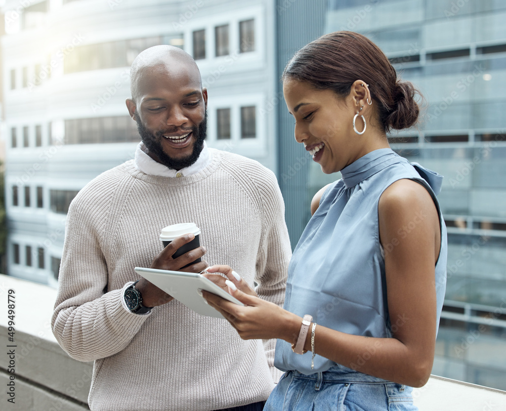 Aufkleber Monitoring trends as they change by the day. Shot of two businesspeople using a digital tablet together outside an office.