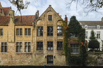 The medieval architecture of Bruges town, Belgium reflected in a water
