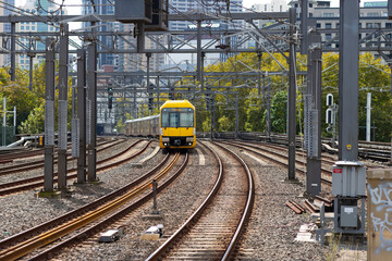Commuter train approaching Homebush train station Sydney NSW Australia
