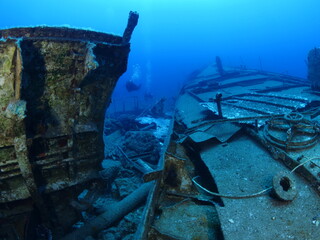wreck underwater shipwreck on seabed sea floor standing metal on ocean floor scuba divers to see