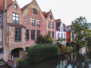 Fototapeta na wymiar The medieval architecture of Bruges town, Belgium reflected in a water 