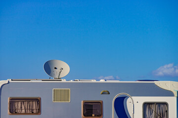 Satellite dish on roof of caravan - obrazy, fototapety, plakaty
