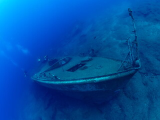 Fototapeta premium ship wreck underwater deep sea bottom metal on ocean floor scuba divers to explore