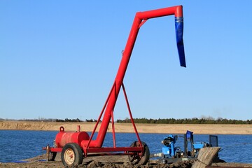 A sand pit water pump at a site for the Kansas Highway Bypass between Nickerson Kansas USA and Sterling Kansas USA out in the country.