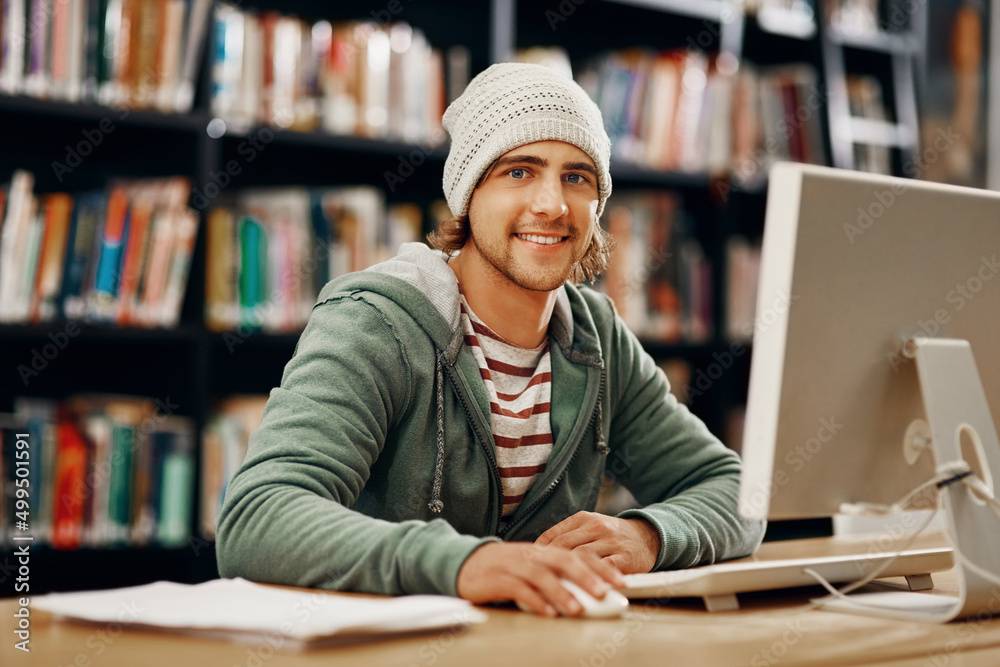 Aufkleber making use of the study tools at my disposal. cropped portrait of a young male university student st