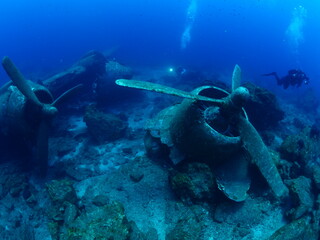 Naklejka na ściany i meble airplane wreck c47 dakota aircraft underwater propeller airplane engine metal on ocean floor scuba divers to explore