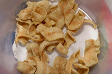 Indonesian snack crisp called kerupuk inside jar