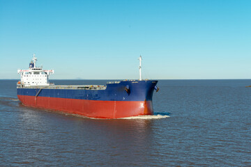 Large bulk cargo ship underway. Big bulker vessel cargo export and import operation.