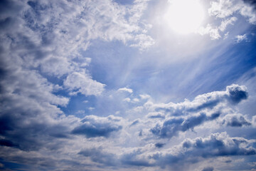 Blue sky with clouds and sunlights