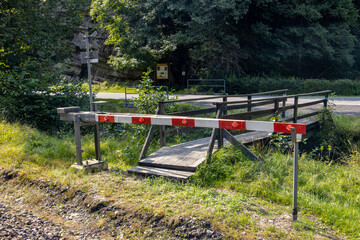 Obraz na płótnie Canvas A barrier in front of a footbridge