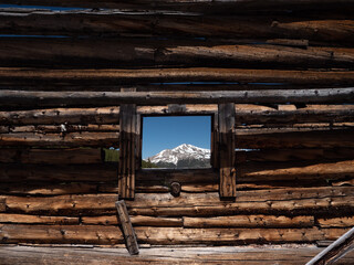 old wooden cabin with mountain