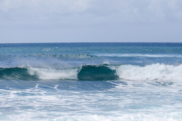 Waves crashing along Sunset Beach on Oahu