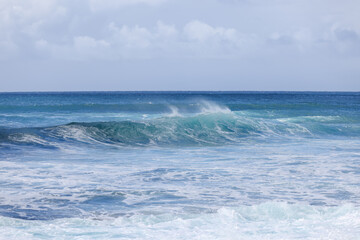 Naklejka na ściany i meble Waves crashing along Sunset Beach on Oahu