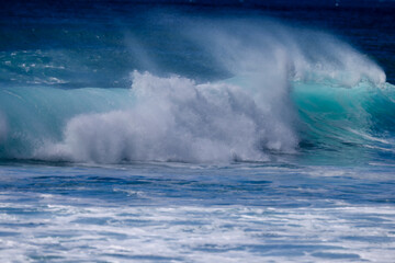 Waves crashing along Sunset Beach on Oahu