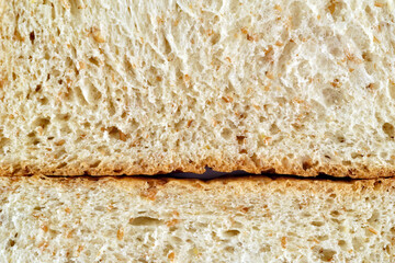 close up shot of a surface texture of sliced whole wheat sandwich bread for food background wallpaper