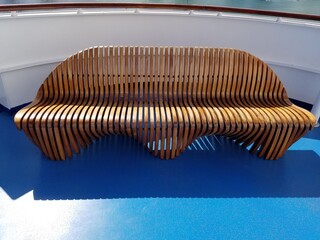 Wooden bench on cruise ship deck