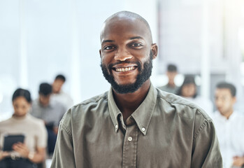 Obraz premium Ready to change the world. Shot of a businessman smiling at a business meeting in a modern office.