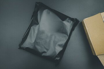 Plastic black bag covering the parcel