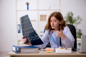 Young female doctor radiologist workiing in the clinic