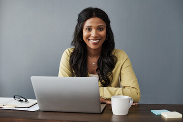 Welcome to my office. Shot of a young businesswoman working from home.