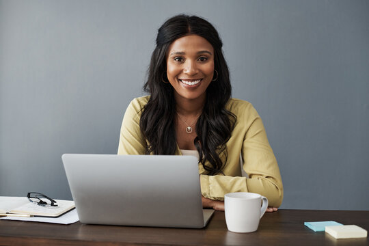 Welcome To My Office. Shot Of A Young Businesswoman Working From Home.