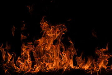 Fire flames isolated on black background. Fire burn flame isolated, flaming burning art design concept with space for text.