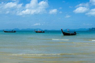 Longtail boats are mooring with the view of Koh Hong or Hong Island from Tubkaak Beach, Krabi, Thailand in the sunny day. One of Thailand's most famous luxurious beach.