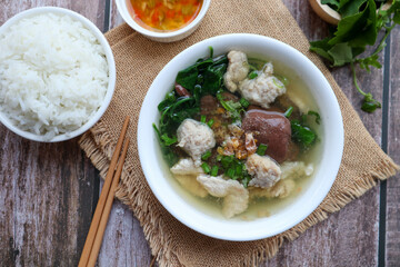 Thai Style clear soup of pork blood, pork and minced pork with jasmine rice - ( Thai- Chinese famous breakfast called Tom Lued Moo at top view )