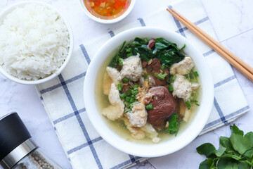 Thai Style clear soup of pork blood, pork and minced pork with jasmine rice - ( Thai- Chinese famous breakfast called Tom Lued Moo at top view )