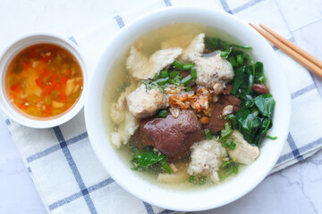 Thai Style clear soup of pork blood, pork and minced pork ( Thai- Chinese famous breakfast called Tom Lued Moo at top view )