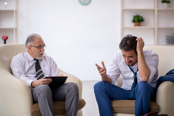 Young businessman employee visiting psychologist