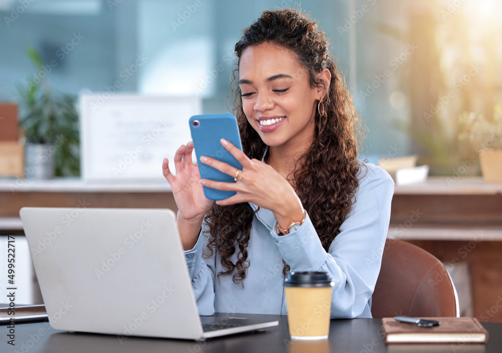 Poster let me send them an update. cropped shot of an attractive young businesswoman sending a text while w