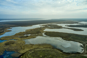 steppe plain landscape lake in the middle of fields