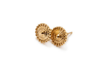 Gold earrings on a white background