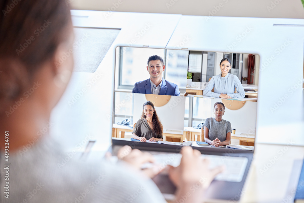 Poster staying connected with the team. shot of an unrecognizable businesswoman on a videocall at work.