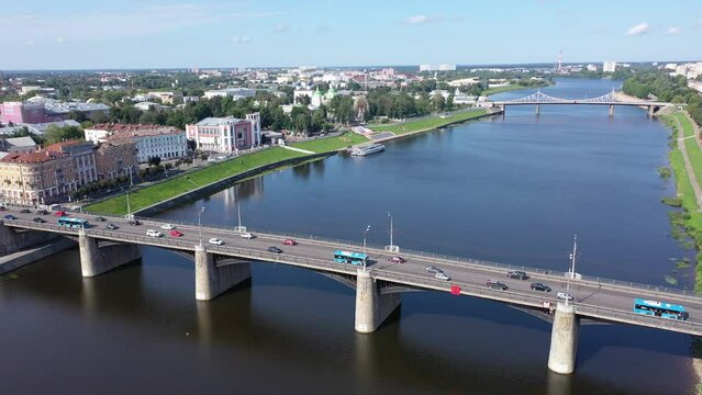 Scenic cityscape of Tver city located on Volga river overlooking residential areas and bridges on sunny summer day, Russia