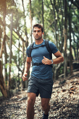 Hiking is his favourite hobby. Cropped shot of a handsome young man running during his hike in the mountains. © Allistair/peopleimages.com