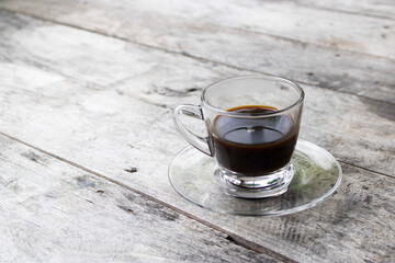 cup of coffee on wooden table