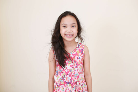 Happy little girl, isolated on white background