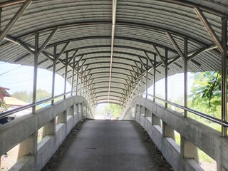 road across the canal with Steel structure roof and road surface in rural areas